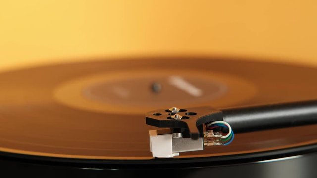 Vintage vinyl record on record player turntable. Lp vinyl record playing on a turntable. Audio equipment for club party.  turntable stylus. Close up. Soft focus