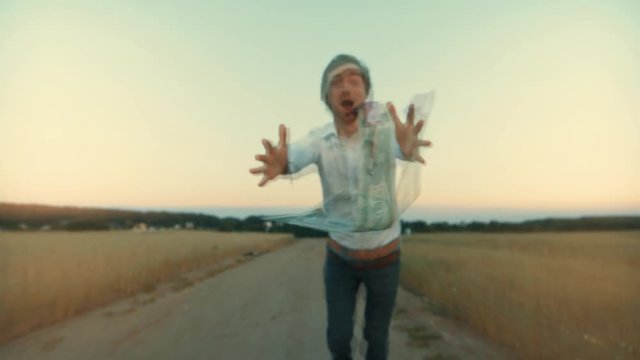 A man chases after a dollar that flies in the wind. the concept of the desire for profit and income