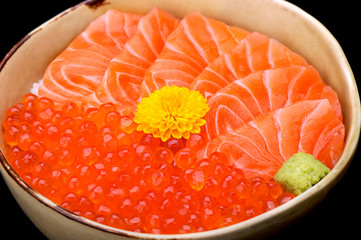 Raw salmon and salmon roe on rice bowl
