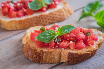 Bruschetta with chopped tomato and basil on toast