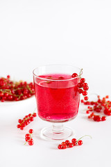 Red Currant Drink in Glass Summer Beverage Tasty Summer Drink White Backgriund Detox Infused Water Vertical