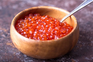 Red caviar in wooden bowl. Seafood