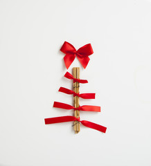 Handmade Christmas tree with wood and ribbons isolated on white 