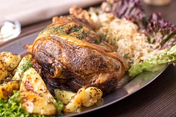 Roast pork knuckle with garnish