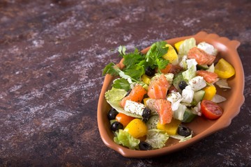 Salad with salted salmon and vegetables . Copyspace