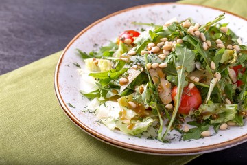Arugula salad with greens and cherry tomatoes