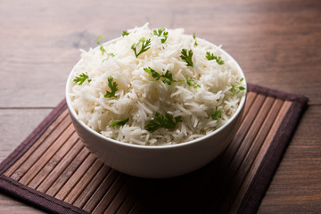 Coriander or cilantro Basmati Rice, served in a ceramic or terracotta bowl. It's a popular Indian OR Chinese recipe. Selective focus