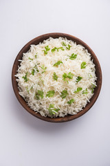 Coriander or cilantro Basmati Rice, served in a ceramic or terracotta bowl. It's a popular Indian...