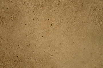 Fragment of a concrete construction slab with a plurality of hollow little holes. Background texture