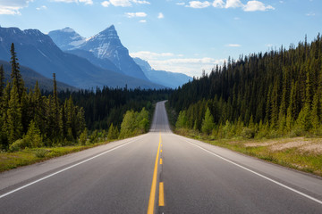 Scenic road in the Canadian Rockies during a vibrant sunny summer day. Taken in Icefields Parkway, Banff National Park, Alberta, Canada. - obrazy, fototapety, plakaty