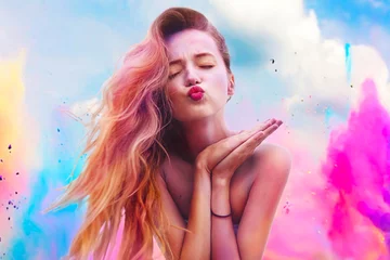 Foto auf Acrylglas Holi Festival Of Colours. Portrait of happy young pretty girl on holi color festival. Girl kiss with colorful long pink and blue hair . Colorful powder paint on dress. Energy, dancing, beautiful woman © MoreThanProd