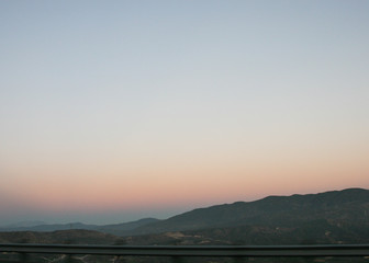 Wallpaper background landscape of Nevada desert valley from a car. Road trip photography. No people.