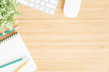 Flat lay photo of office desk with mouse and keyboard ,Top view workpace on bamboo wood table and copy space