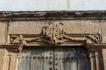 old coat of arms of the Spanish Inquisition in the town of Villanueva de Los Infantes, in Spain.