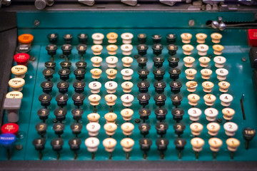 Naklejka premium Selective focus, vintage calculator machine