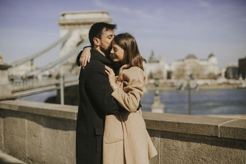 Couple in love hugging with magnificent view of Budapest, Hungary