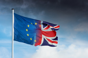 European and british flag merging with dark clouds and lightning bolt as sign for Brexit