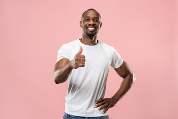 The happy businessman standing and smiling