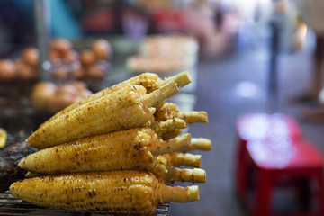 Street food, grilled corn stand in Asia