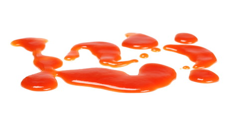 Tomato juice, red ketchup splashes isolated on white background and texture