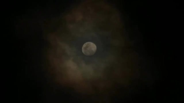 Amazing clouds passing a full moon in the night. It can be for a horror or even romantic , supernatural scene and more.