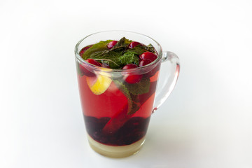 Mulled wine with cinnamon, lemon, mint, blueberries, cherry.