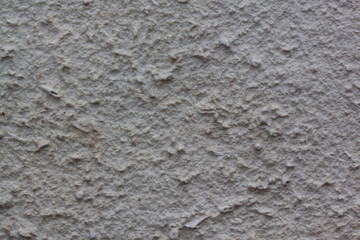 Gray plastered handmade rough wallpaper. Beautiful decorative gray plastered wall.