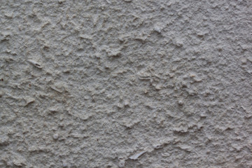 Gray plastered handmade rough wallpaper. Beautiful decorative gray plastered wall.