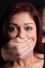 stranger covering the mouth of a terrified girl