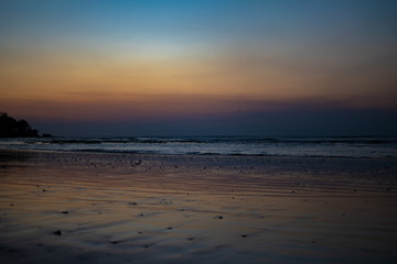 Fototapeta na wymiar beautiful sunset on the beach of the Jimbaran village . Bali, Indonesia