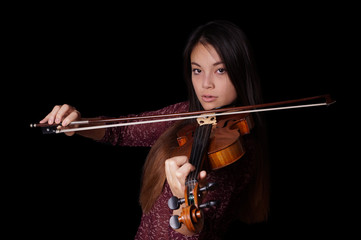 young asian woman playing violin or fiddle