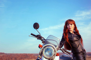 Fototapeta na wymiar the girl next to the motorcycle