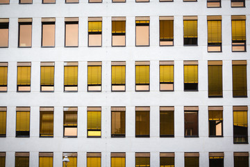 office high-rise house facade with gold chrome louvres