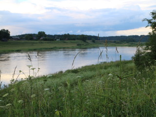 picturesque banks of the river in the summer evening