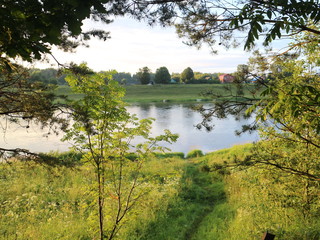 picturesque banks of the river in the summer evening