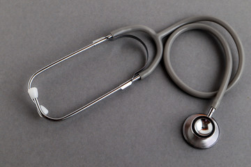 Medical equipments including stethoscope medicines background, top view flat lay