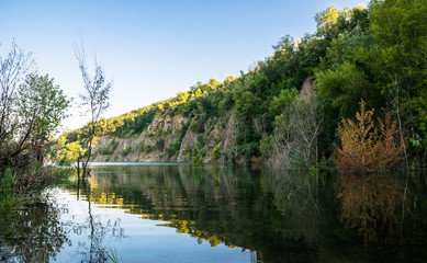 Fototapeta na wymiar Rocks and a mountain lake in summer
