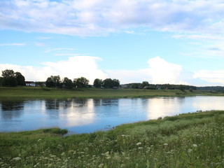 picturesque banks of the river in the summer evening