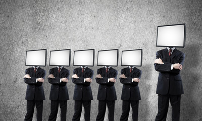 Businessmen with TV instead of head.