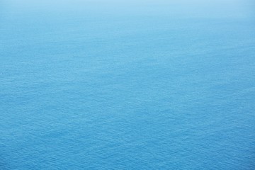 Blue Sea surface aerial view with waves from a drone, empty blank to  background