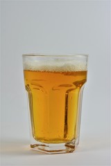 A glass of beer on a white background