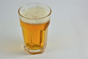 A glass of beer on a white background