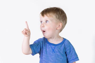 Portrait of cheerful kid boy showing good idea on fingers - isolated over white background