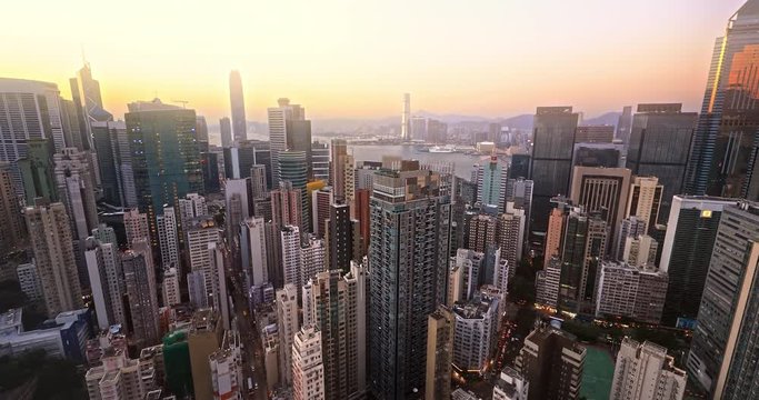 Hong Kong harbor view at sunset. Panoramic skyline cityscape aerial landscape