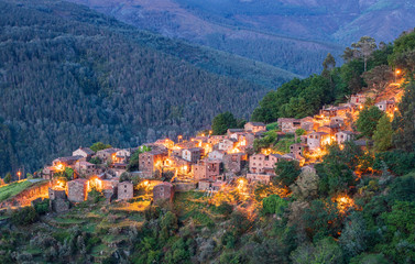 View of Talasnal shale village at dusk, Portugal. With outdoor lighting on.