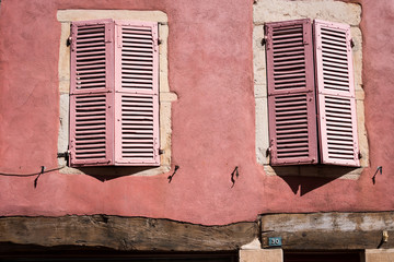 Colourful pink shutters in Macon, France