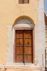 Fototapeta premium Old wooden door with metal embossing in Jaipur, India
