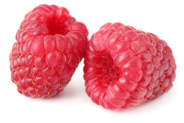 ripe raspberries isolated on white background macro