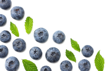 healthy background. blueberries with leaves isolated on white background. top view