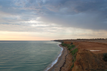 Black Sea coast. the shore consists mainly of land and can collapse. over the coast hung thunderclouds